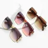 Zonbrillne Gafas de sol de recorte sin marco Ins Gran Frame Street Shot de alta gama UV Protection HD Gafas de sol de moda femenina al por mayor