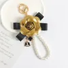 Brand Keyring Black Camellia PU Leer Bloem Klaver Key Ketens Holder Gold Metal Imitatie Parel Bracelet Auto Keychain Ring Hanger Bag Charm Sieraden Accessoires