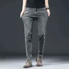 Jeans spessi invernali da uomo autunnali Pantaloni dritti sottili elastici per giovani di marca di moda da uomo