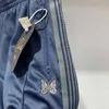 Marineblauwe naalden broek mannen vrouwen joggt joggers zacht materiaal vlinder borduurwerk trekkoord zipper zakbroek