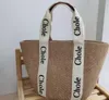 Hot Sell Style Style Straw Locen Bag 2022 New Summer Summer عالية السعة الترفيهية حقيبة محمولة منسوجة للنساء حقيبة الكتف على الشاطئ 221K