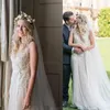Boho Country Wedding Suknie 2022 Vintage Fairy Lace Floral V-Neck Pełna długość wiejskiej suknia ślubna plażowa