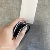 Mode simple noir blanc acrylique tête corde élastique anneau de cheveux épingle à cheveux bijoux de couvre-chef populaires en co3101 européen et américain