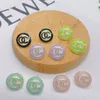 Marque de luxe Designers Lettres Oreille Stud Couleur Bonbon Rond En Acier Inoxydable Géométrique Célèbre Femmes Sceau En Acier Imprimer Haute Qualité Ear8477938