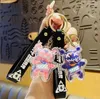 Keychains Creative 3D Animal Röntgenbatteribjörn Spelfigurer Keychain Arylic Doll Cosplay Key Ring Diy Car Holder Anime Trinket D972 Fred22