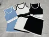 Vrouwen tweedelige jurk set gebreid vest mini korte rok set streetwear mode crop top kleine letter 4 kleuren trainingspak