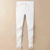 Fin haut automne et hiver 2022 jean blanc marque de mode pour hommes coupe ajustée petit pied décontracté pantalons longs