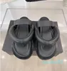 Modekvinnor lyxdesigner sandaler toffel läder sommar platt toffel broderi mode strandkvinna stora huvud regnbågen bokstäver