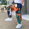 Ragazzi Stampa Pantaloni casual Estate Graffiti Designer Pantaloni sportivi Pantaloni lunghi sottili Vestiti per bambini adolescenti per 2 12 Y 220808