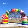 Şişirilebilir Gökkuşağı Kemeri 7m Havalandırıcı Renkli Şeker Archway, Tatlılarla Açık Mekan Parkı Etkinliği