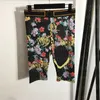 Pantaloni da yoga Tute con stampa di fiori vintage T-shirt a maniche corte Moda Leggings sportivi sexy per signora