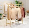 Corridor Rack Commerciële meubels Kledingwinkel Creatieve cirkelvormige schoenenplank Dubbele rij vloer Type Gouden kleding Hanger Damesstoffen Winkelrekken