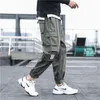 Męskie spodnie boczne kieszenie ładunki czarny hip hop harem swobodny męski joggery spodnie dresowe mody streetwearne spodni 5xl 220826