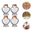 Kleines herzförmiges Vorratsglas aus klarem Glas, Flaschenbehälter mit Korkstopfen, gefüllt mit Geleekugeln und Edelsteinen