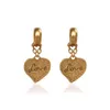 Bump texture love pêche coeur boucles d'oreilles étalons rétro tempérament haut de gamme marée de mode cool fashion street tout-correspondant bijoux accessoires