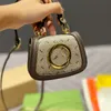 Mini bolsas bolsas Bolsa de corpo transversal Mulheres metal fivela de couro genuíno Canvas de moeda de moeda Hardware de hardware letra de intertravamento Hasp Sacos de ombro pendente de ombro com caixa