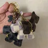 犬デザインキーチェーンアクセサリーファッションタッセルキーリング Pu レザーベル車のキーホルダーホルダー漫画ジュエリーバッグチャームペンダントキーリングギフト