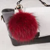 Portachiavi Portachiavi di lusso in vera pelliccia Portachiavi con pompon 15cm Fluffy Raccoon Ball Gold Pompon Portachiavi Charm Bag Ciondolo RegaliPortachiavi