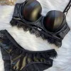 PU-Leder-BH-Unterhosen-Set, sexy Innen-Damen-Spitzen-Dessous-Slip-Anzug mit Stahlring-Stereotypen und Wimpern-Bralette 220513