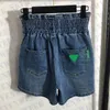 diseñador Diseñador de moda para mujer Pantalones cortos de mezclilla Pantalones vaqueros elásticos de cintura alta Pantalones cortos Grado Ropa de mujer QAFO