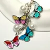 Trendiga färgglada fjäril nyckelring med pärlnyckelkedjor Keyring för kvinnor Bag charms tillbehör smycken gåvor