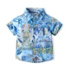 15933 Summer pojkar kläder set strand baby barn blommor målning kort ärmskjorta med shorts 2st.