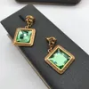 Colliers pour femme avec chaîne en laiton et pendentif en cristal vert Boucles d'oreilles en pierres précieuses Ensemble de motifs de méandres grecs Banshee Tête de Méduse Portrait Plaqué or 18 carats Bijoux de créateur