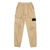 Printemps et automne Pantalons pour hommes sports de plein air Combinaison de jogging Attacher ses pieds temps libre Salopette Style badge brodé Marque de mode américaine européenne