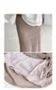 Ny mode kvinnors virkning stickad kjol ihålig ut elastisk midja penna maxi lång kjol fast färg