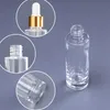 Flacons compte-gouttes en verre transparent de 30 ml Bouteille de parfum d'huile essentielle d'épaule plate à paroi épaisse de 1 oz avec capuchon supérieur doré