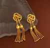 Bengelen kroonluchter creatief geknoopte ontwerp oorbellen retro thread kwastje long golden ball elegante vrouwen vintage sieradengange