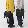 Moda de grande capacidade para bolsas de ombro oblíquas homens e mulheres estão disponíveis Bolsa de bolso dianteiro preto