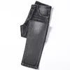 الجينز الجينز جان هوب هوب سروال شارع تريند سترينز سلسلة زخرفة تمزق سوداء أزياء سليمة رفيعة