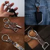 Keychains Super Light TC4 Titanium Alloy Men's Keychain Hoge kwaliteit Cowhide Taille Hanging Car Key Chain Ring High-End Gifts for Menkeyc