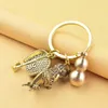 Keychains Brass Gourd Key Pendant Emperor Jiuzi Dustpan Small Keychain Leaf Pixiu Car Chain Chinese Feng Shui AntiqueKeychains Emel22