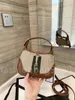 Luxury Designer Real Leather Hobo hasp axelväskor Underarm handväskor för kvinnor berömda varumärke Kvinnor dubbla bokstäver 20 cm små purs Axilla handväska plånbok väska