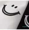 T-shirt da donna Top T-shirt a maniche corte bianca nera allentata T-shirt stampata con faccina sorridente