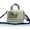 Designer Luxurys 디자이너 핸드백 50362 숄더백 고품질 클래식 Epi Grained 가죽 사선 가방 Wild at Heart 시리즈 Twist medium totes