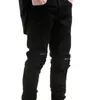 Herrbyxor europeiska och amerikanska high street mode varumärke Pure Black Slim Fit Elastic Jeans med små fötter Män män Fashionmen's