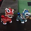 Keychains dance chino dance león ópera ópera llave cadenas portavasos animal de cristal para automóvil