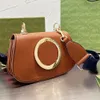 Blondie schoudertas lederen cross body canvas riem lederen bekleding katoen linnen voering ronde in elkaar grijpende designer luxe tassen