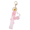 Chaveiro de flor de sakura de óleo criativo feminino chaveiro de lantejoulas líquido bolsa charmosa pingente de carro chaveiro para presente infantil