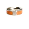 Nieuwe verkoop Hoogwaardige ontwerper Orange Color Titanium Steel Couple Bandringen klassieke populaire ringen voor mannen en vrouwen