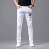 Jean en coton blanc pour hommes, Version coréenne, petit pied, coupe Slim, marque internationale haut de gamme, broderie de luxe légère