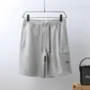 Vendita di pantaloncini estivi in spugna di cotone Stile europeo americano hip hop street style corto moda che corre sciolto ad asciugatura rapida Processo di lavaggio di pantaloni da spiaggia in tessuto di puro cotone