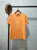 Designer-Frau-T-Shirt, modisches Oberteil, Herren-Münzen-Buchstabendruck mit Knopfleiste, Damen-T-Shirt, weiße Baumwolle, kurze Ärmel, Sommer für Liebhaber, Str224Y