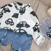Camisa de desenho animado de meninos Primavera e verão Camisa de bebê coreana de bebê de estilo estrangeiro de estilo estrangeiro