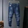Jeans pour hommes belle marque d'automne grande taille ample Harem classique poche Patching Style jeunesse hommes mode Denim noir bleu hommes