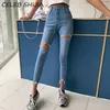 SHIJIA Herbst Frauen Denim Jeans Quaste Dünne Blaue Zerrissene Löcher Chic Böden Hohe Taille Stretch Unregelmäßige Jeans Weibliche 210302