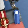 Porte-clés rouge à lèvres, sac de brillant à lèvres, porte-clés, bouteille portable, couverture d'emballage, conteneur cosmétique, porte-clés